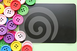 Chalk Board surrounded by colorful buttons