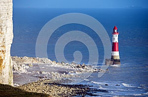 The famous Beachy Head lighthouse and chalk cliffs near Eastbourne in East Sussex, England