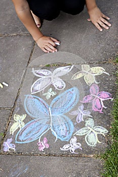 Chalk drawing of butterflies on sidewalk