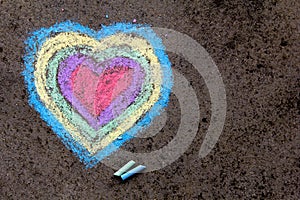 Chalk drawing: colorful hearts on asphalt photo