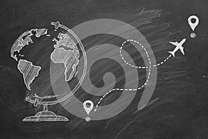 A chalk drawing of a globe with airplane route and destination markers