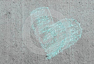 Chalk drawing of a heart on a sidewalk