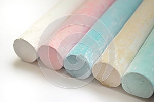 Chalk for drawing multicolored white, pink, blue, yellow, green on a white background