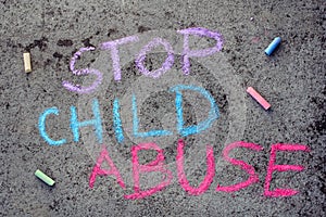 chalk drawing: words STOP CHILD ABUSE photo