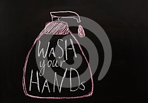 Chalk inscription on blackboard-Wash your hands. Background pandemic coronavirus COVID-19 concept. Covid19, health