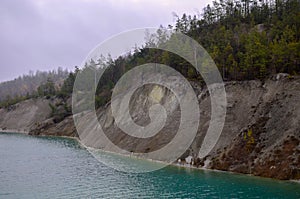 Chalk quarry artificial lakes in autumn season. Technogenic open pit is known as the Belarusian Maldives, which is in great demand