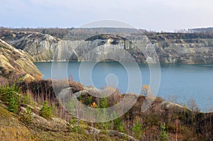 Chalk quarry artificial lakes in autumn season. Technogenic open pit is known as the Belarusian Maldives, which is in great demand