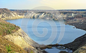 Chalk quarry artificial lakes in autumn season. Technogenic open pit is known as the Belarusian Maldives, which is in great demand