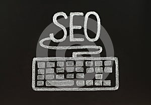 Chalk SEO concept with keyboard