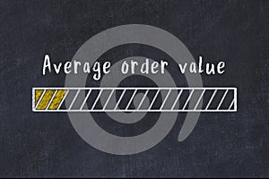 Chalk sketch of progress bar on black desk with small load. KPI evaluation concept