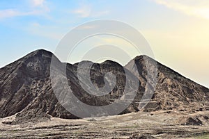 Chalk structure on artificial mountain after quarry mining. Technogenic rock formed during mine. Mountain hill with chalk fossil