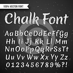 Chalk white calligraphy letters, vector writing alphabet isolated on black chalkboard photo