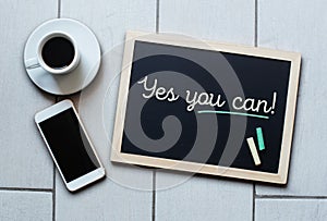Chalkboard or Blackboard concept saying - Yes you can