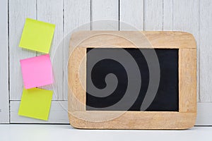Chalkboard and blank sticky note, post note on Office