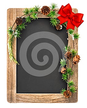 Chalkboard with christmas decoration and red ribbon bow photo