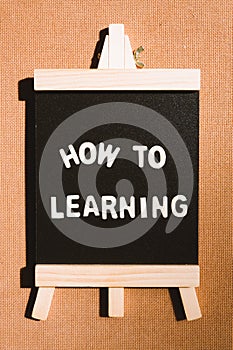 Chalkboard contain the words how to and learning using as business and education concept