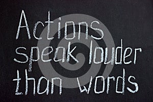 Chalkboard lettering `Action speak louder than words` photo