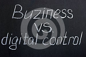 Chalkboard lettering `Buziness vs. digital control`.