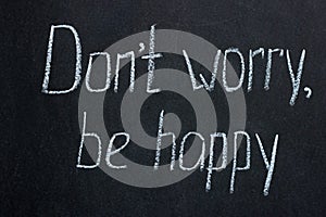 Chalkboard lettering don`t worry, be happy. Positive phrase photo