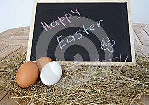 Chalkboard with text Happy Easter and natural eggs
