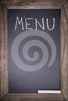 Chalkboard with wooden frame for restaurant with written text menu layout template background