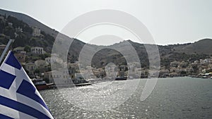 Chalki / Halki island, Greece - Slow pan shot of complete beautiful greek inhabited island with bright color houses of ceramic-