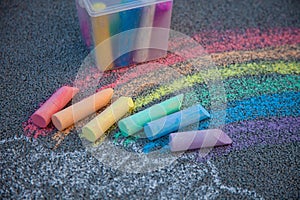 Chalks in rainbow colors. Chalk for drawing on the school board and on the street on the pavement. Children's toy is