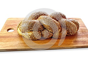 Challah on kitchen wooden cutting board on white isolated background. Challah Hallah -  Jewish bread  on Israel and the Jewish d