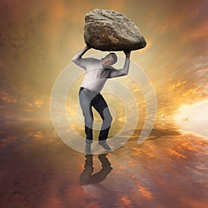 Challenge concept. Man with boulder