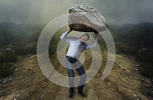 Challenge concept. Man with boulder