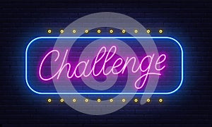 Challenge Neon Sign on brick wall background.