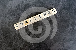 Challenge text on wooden block