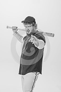 Challenge. Thrilled male baseball player wearing retro sports uniform and holding bat isolated on white background