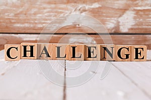 CHALLENGE word. Alphabets written on wooden background