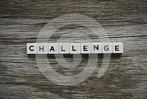 Challenge word made of square letter word on wooden background