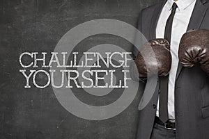 Challenge yourself on blackboard with businessman