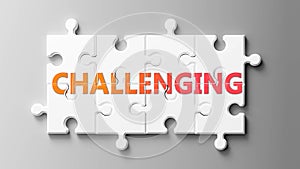 Challenging complex like a puzzle - pictured as word Challenging on a puzzle pieces to show that Challenging can be difficult and