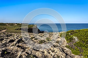 Challenging off-road route along the steep cliffs of the Sinis peninsula near Oristano, Sardinia, Italy