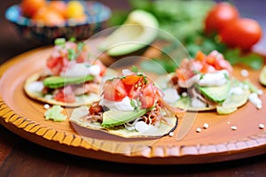 chalupas with avocado slices and sour cream