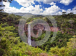 Chamarel waterfalls in Mauritius against the cloudy sky