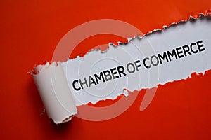 Chamber Of Commerce Text written in torn paper