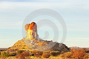 Chambers Pillar Historical Reserve at sunrise in the Red Center of Australia