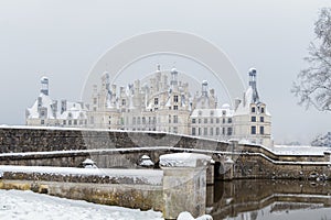 Chambord castles in winter under snow, Loire Valley, France