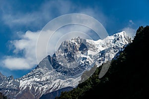 Chame - A distant view on barren slopes of Himalayas