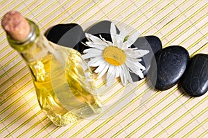 Chamomile, oil and stones