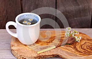 Chamomile tea with chamomile daisy flowers