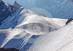 Chamonix, south-east France, Auvergne-RhÃ´ne-Alpes. Climbers heading for Mont Blanc. Descending from Aiguille du Midi cable car st