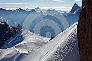 Chamonix, south-east France, Auvergne-RhÃ´ne-Alpes. Climbers heading for Mont Blanc. Descending from Aiguille du Midi cable car st