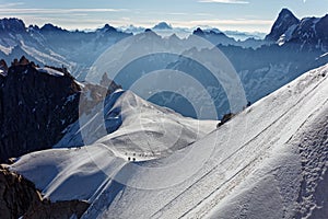 Chamonix, south-east France, Auvergne-RhÃ´ne-Alpes. Climbers heading for Mont Blanc. Descending from Aiguille du Midi cable car st