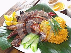 Chamorro- beef kelaguen and potato salad in banana leaves